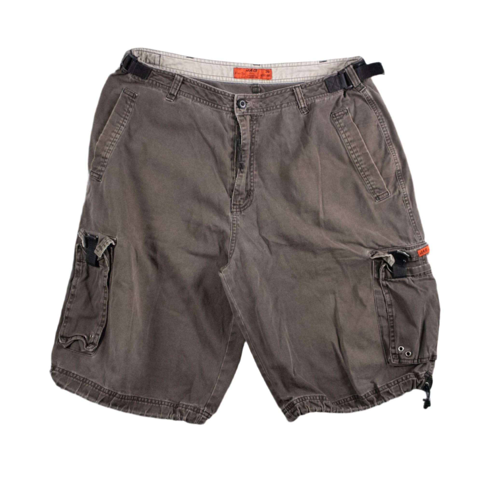 Brown cargo shorts on a textured gray background
