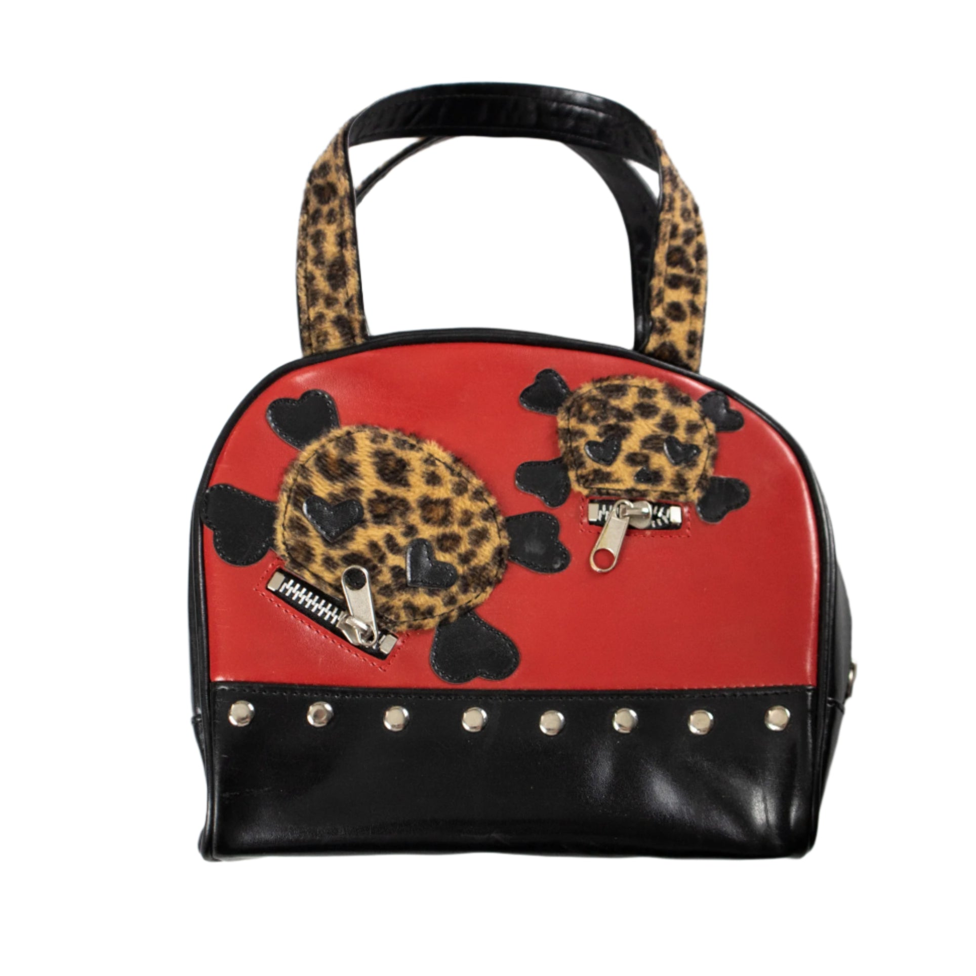Handbag with leopard print turtles and black accents on a white background