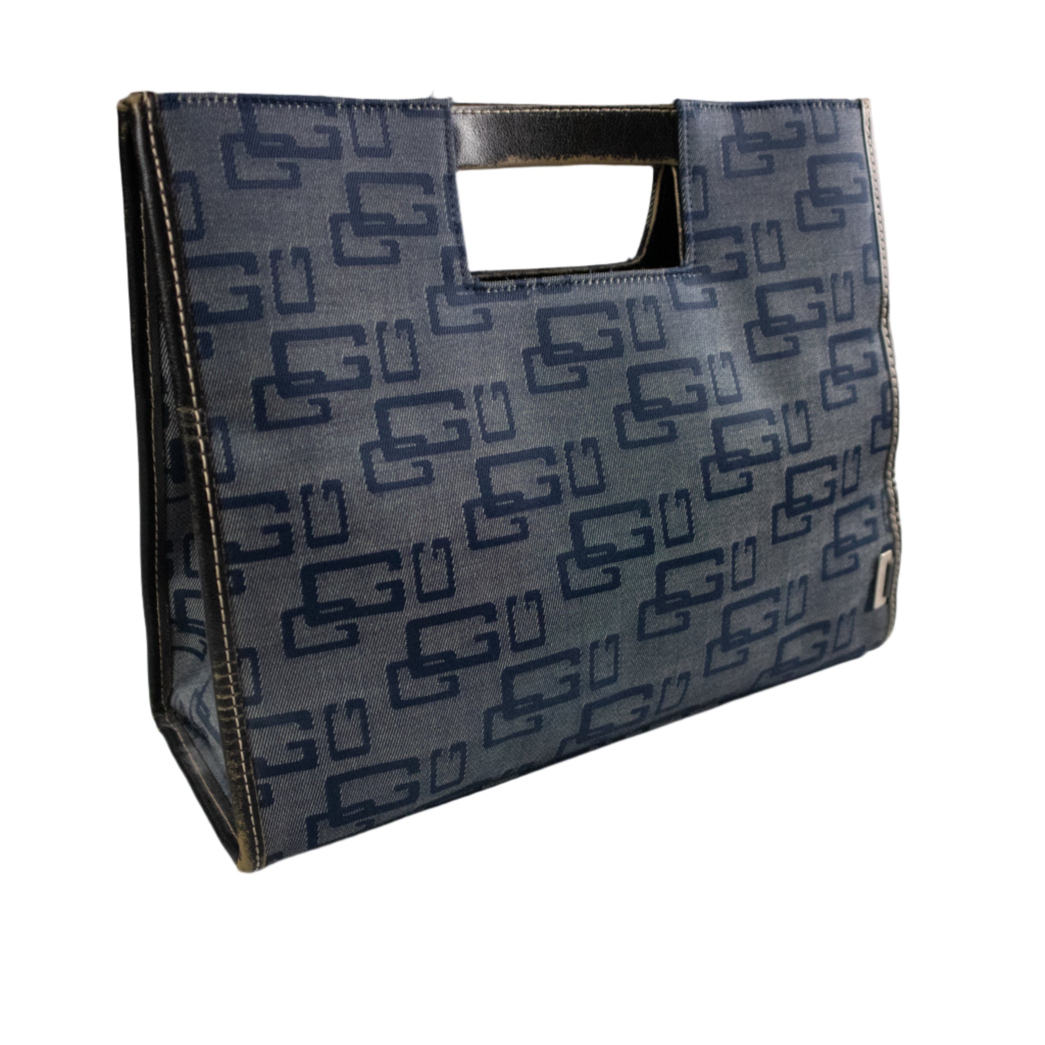 Blue patterned bag on a white surface with a gray background