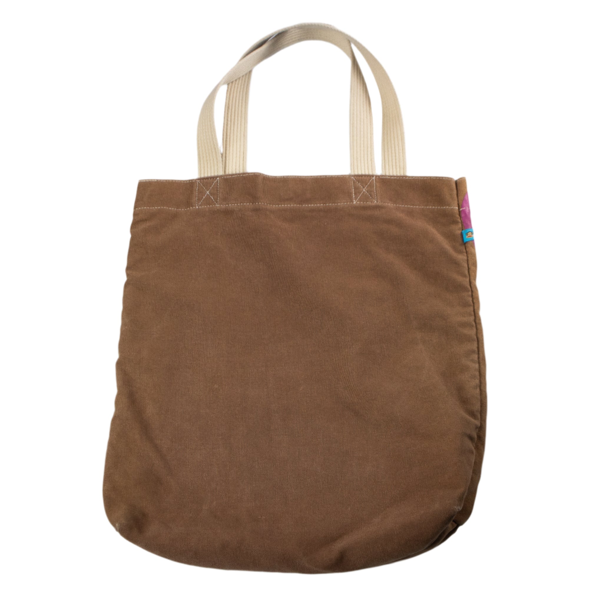 Brown tote bag with beige handles on a white background