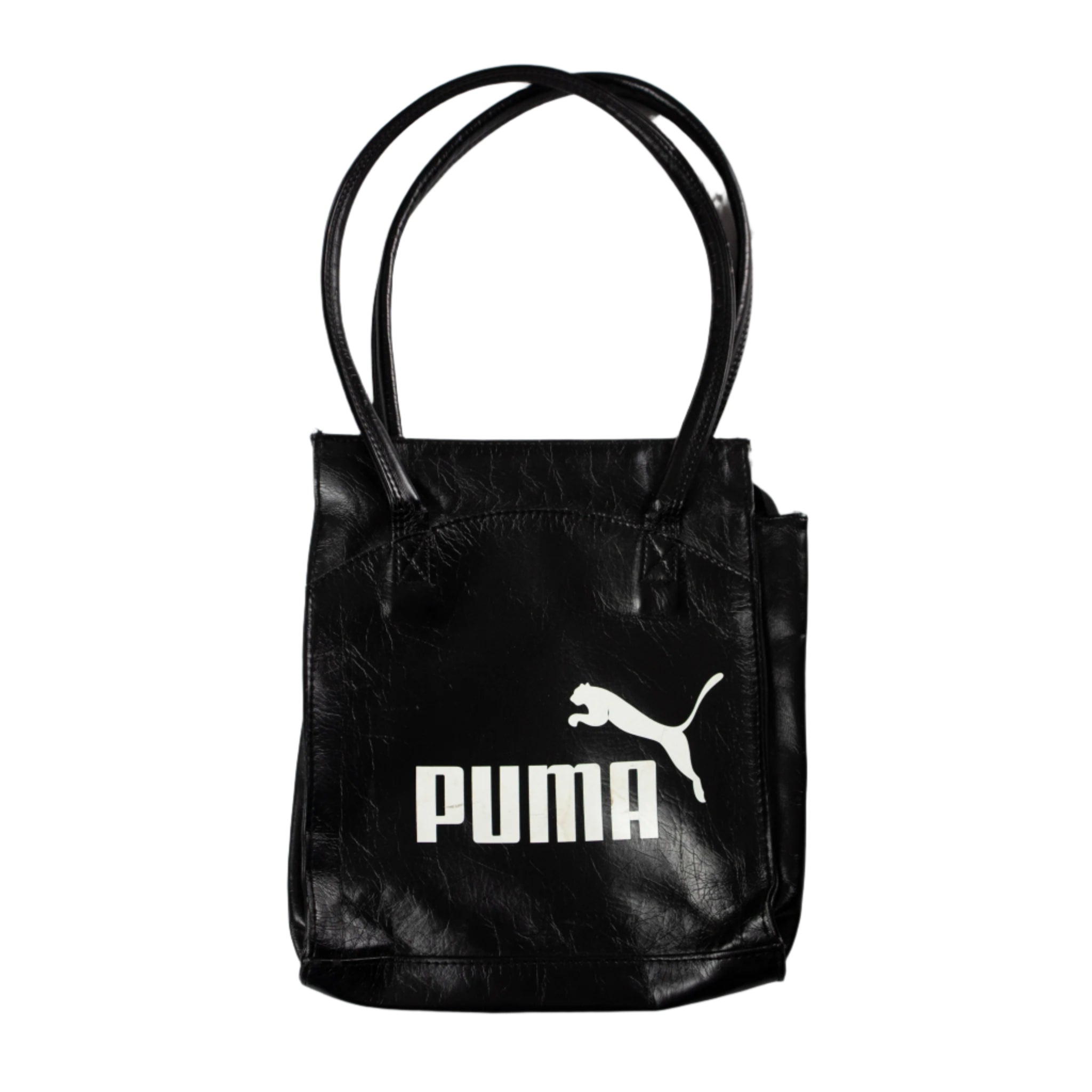 Black Puma tote bag on a light gray background