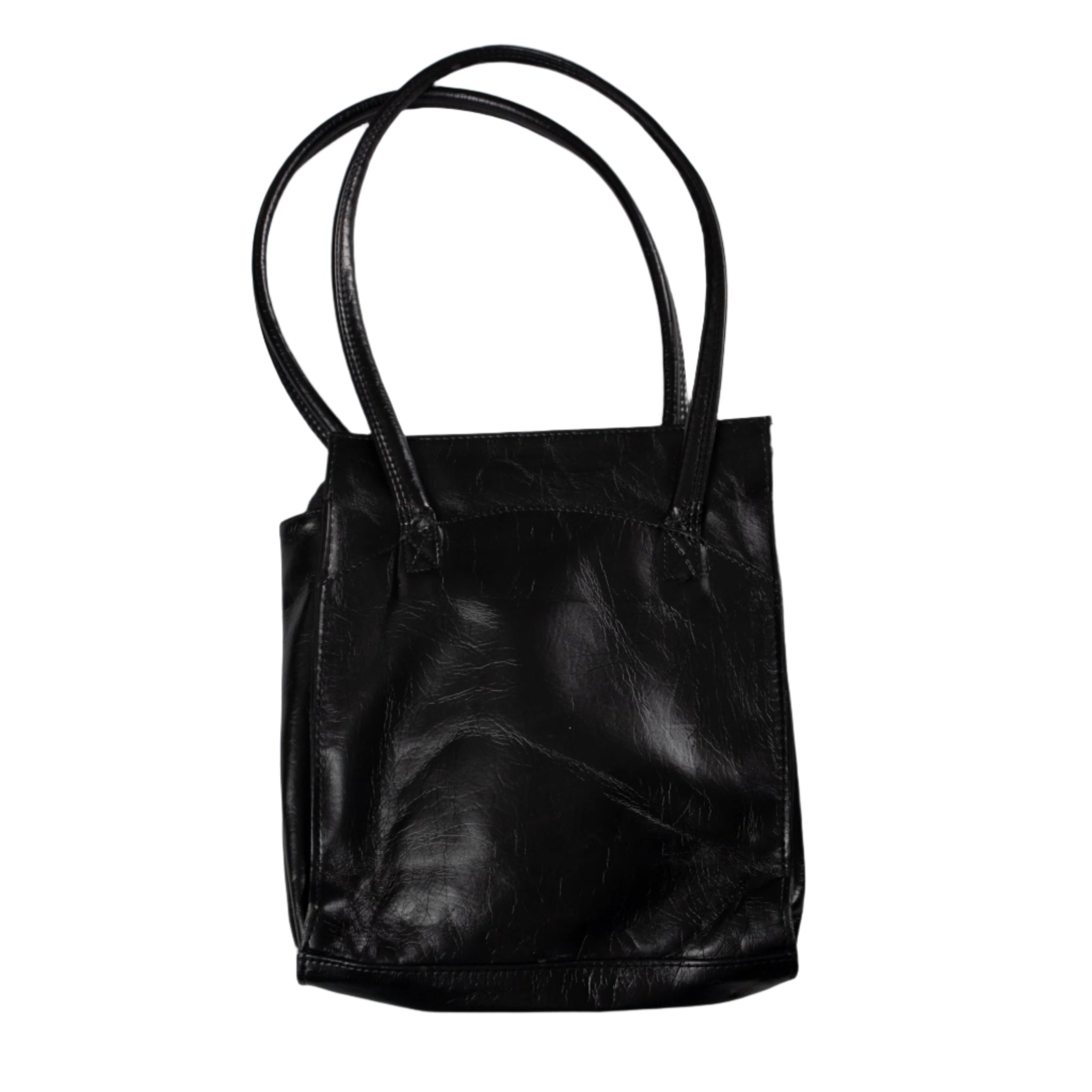 Black leather tote bag on a light gray background