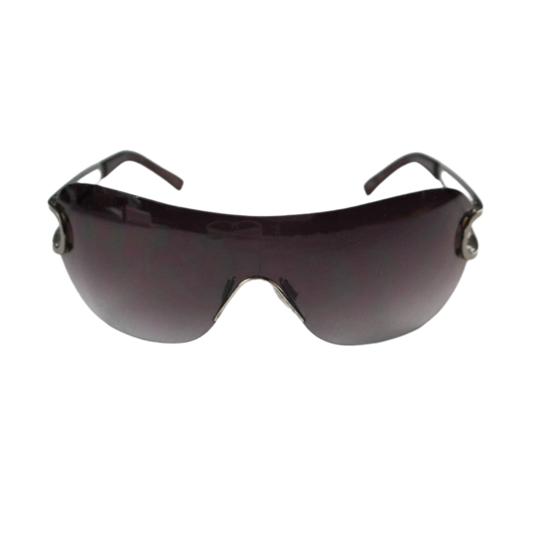 Sunglasses with dark lenses and thin frame on a light gray background