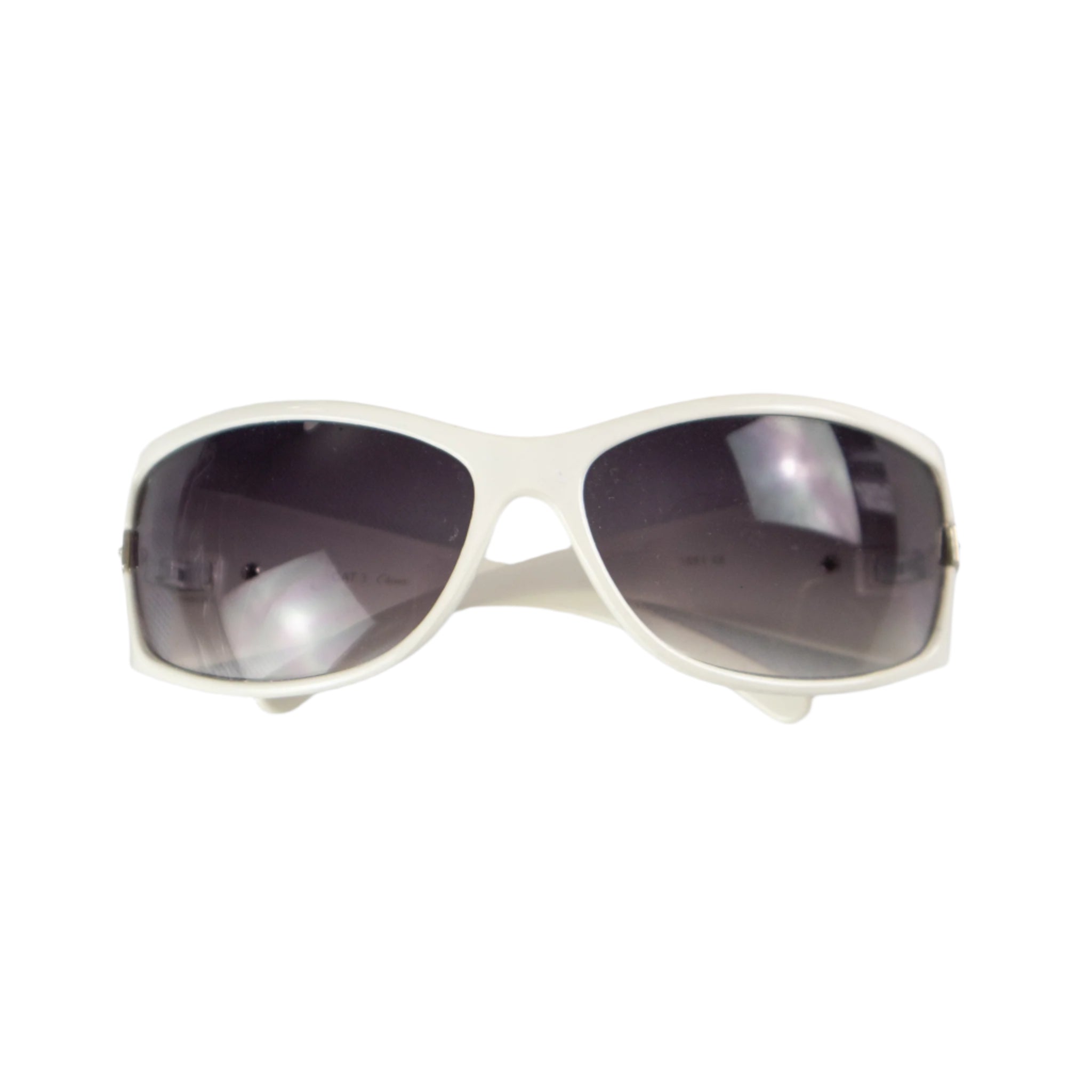 White sunglasses with dark lenses on a light gray background