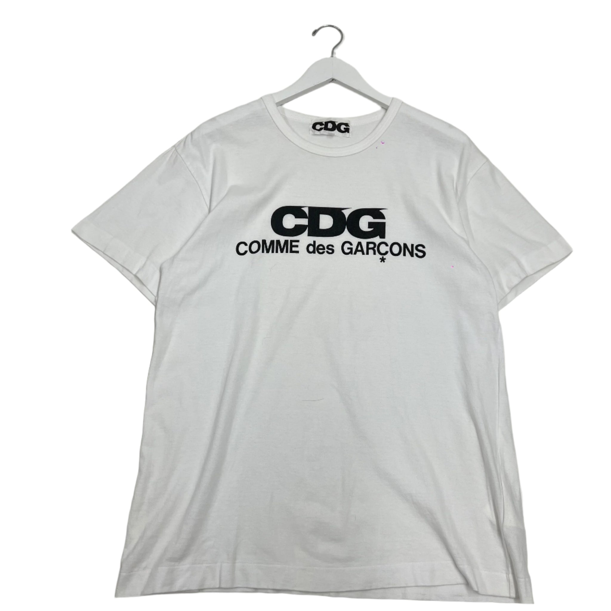 Comme des Garçons graphic T-shirt featuring abstract print design. Avant-garde streetwear from the iconic Japanese fashion house