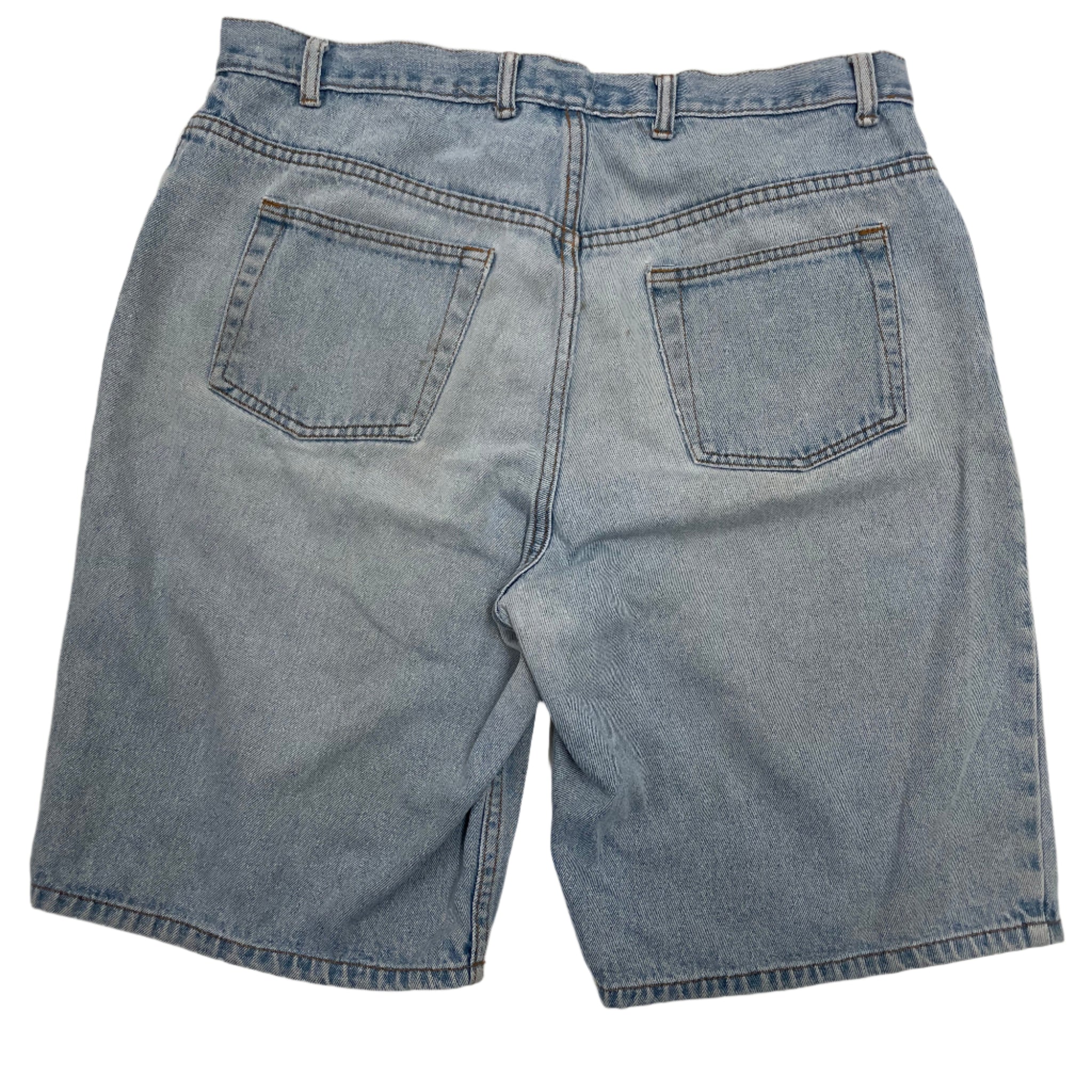 Pair of blue denim shorts on a light gray background