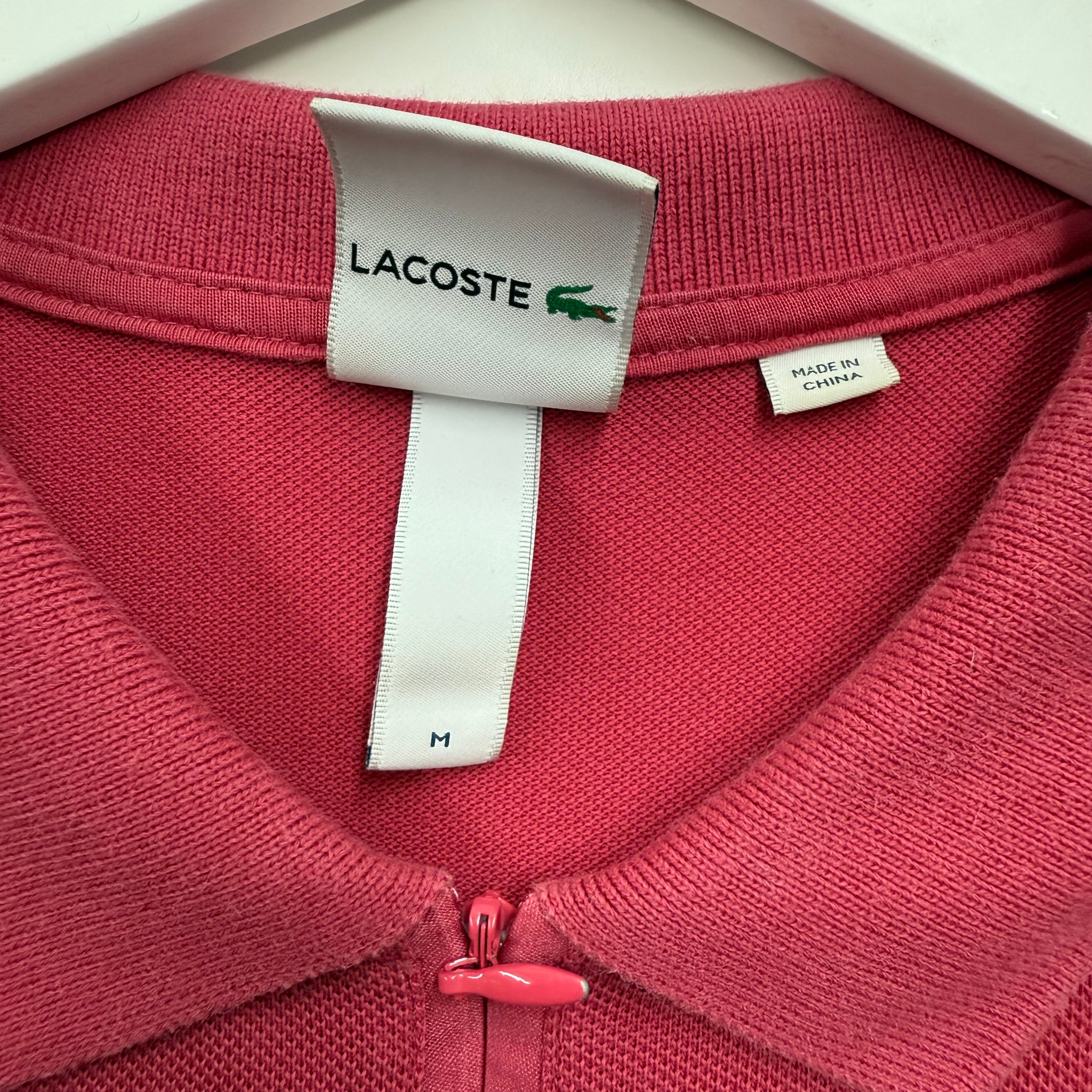 Supreme x Lacoste pink polo collab streetwear vancouver vintage tag