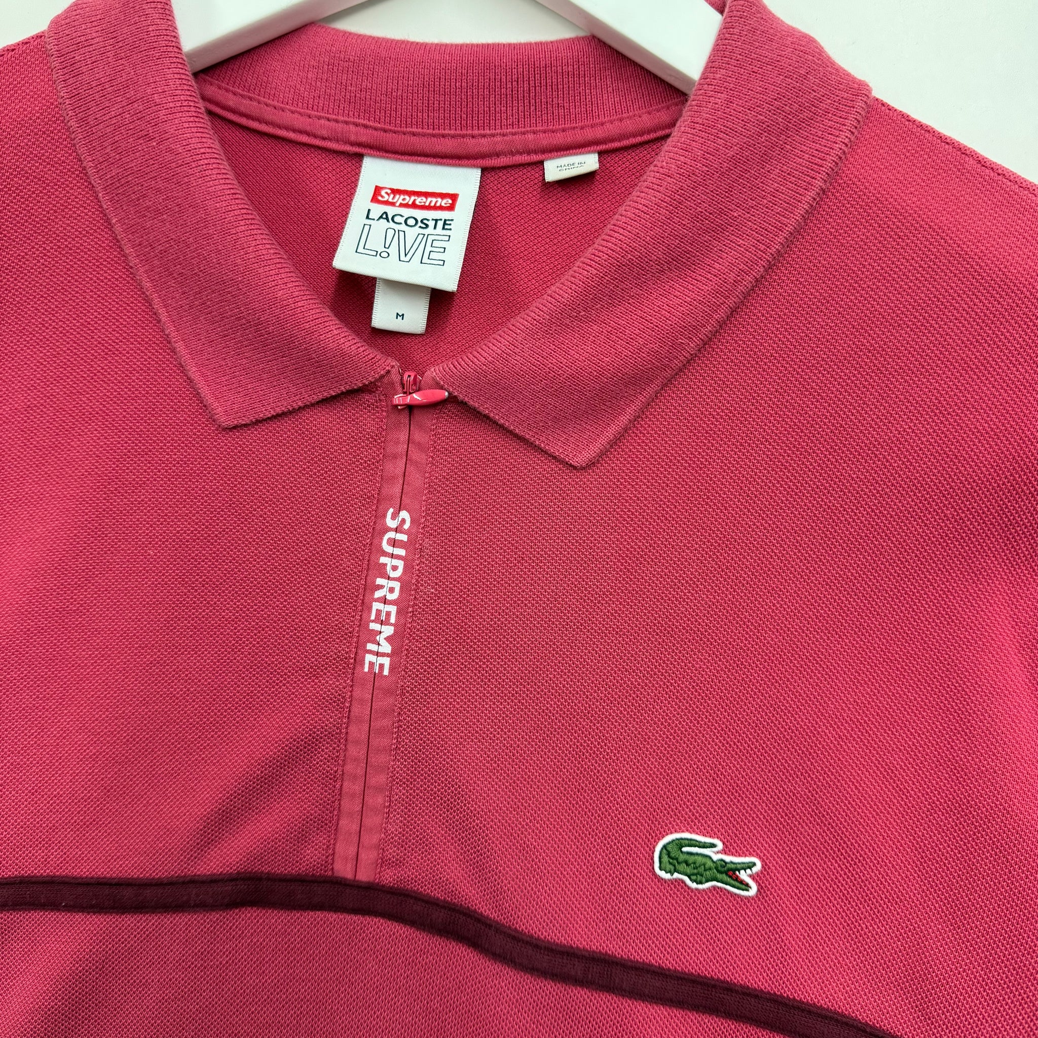 Supreme x Lacoste pink polo collab streetwear vancouver vintage tag