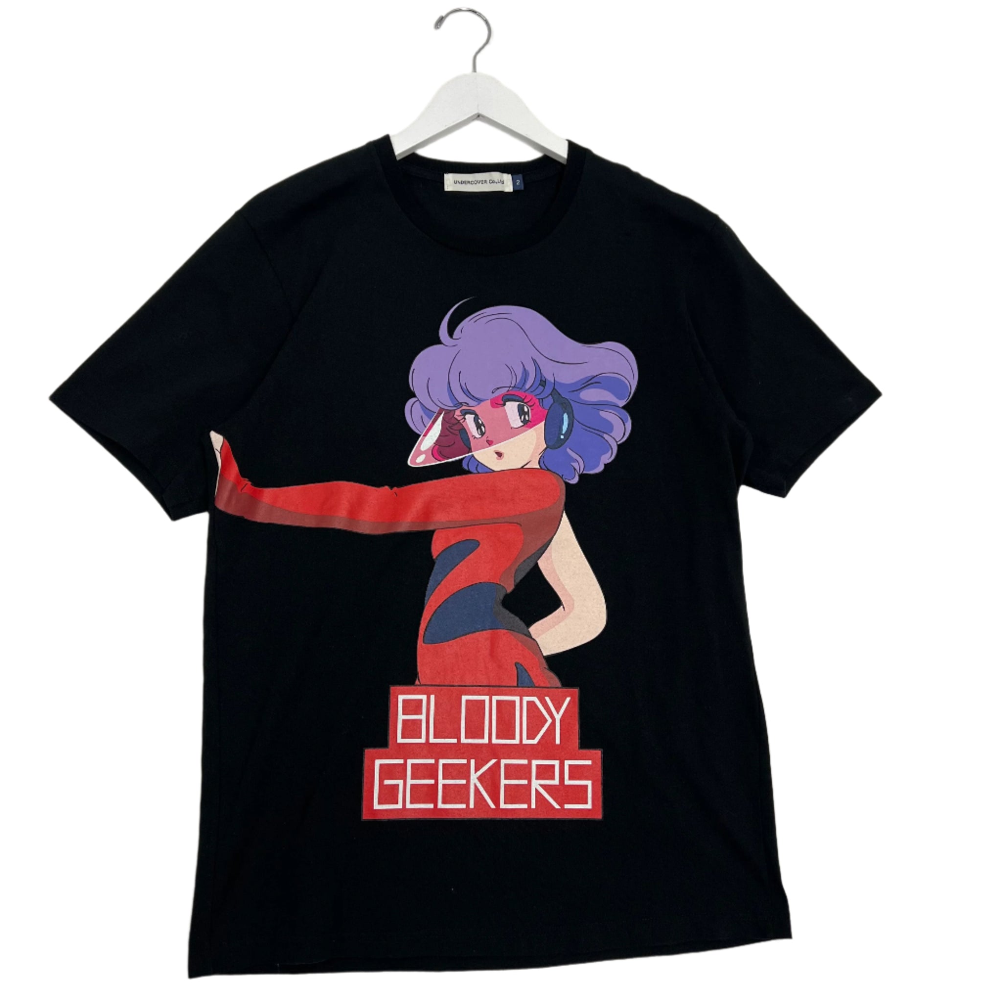 Undercover ‘Bloody Geeker’ T-shirt featuring graphic print of a bloodied anime-style character. Iconic and rare piece from Jun Takahashi’s early 2000s collection.