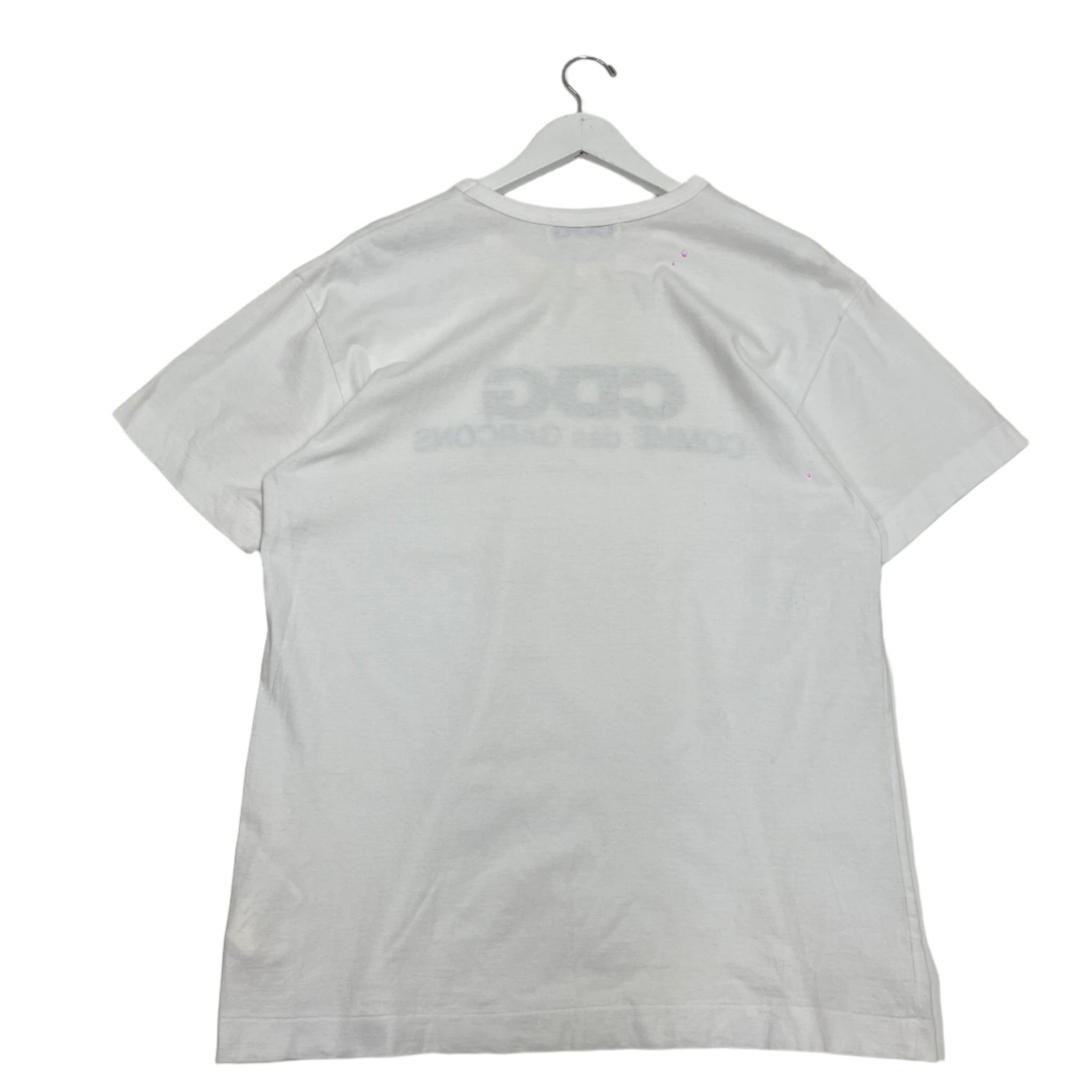 Comme des Garçons graphic T-shirt featuring abstract print design. Avant-garde streetwear from the iconic Japanese fashion house