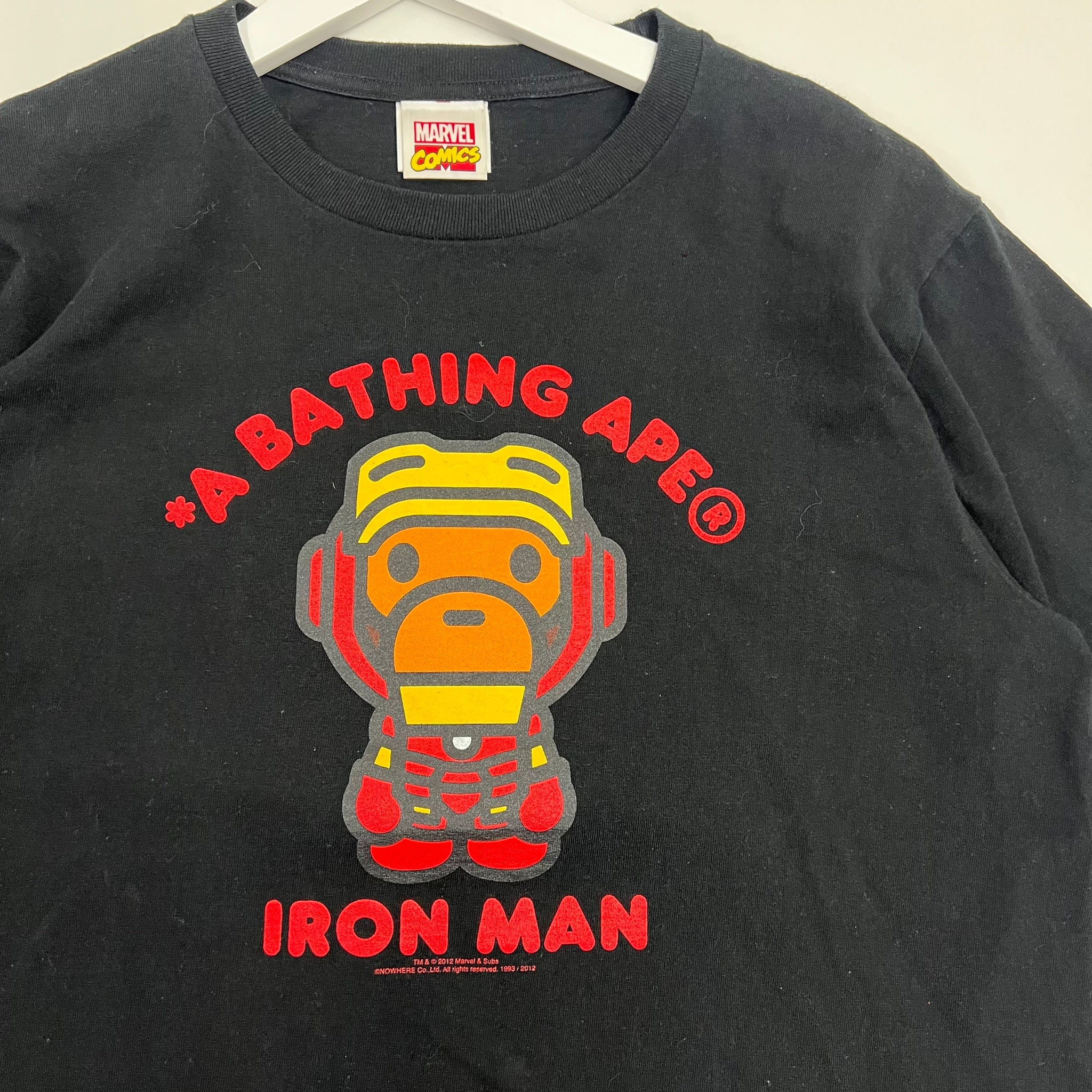 A Bathing Ape x Marvel Iron Man T-shirt featuring Iron Man in BAPE’s signature cartoon style with bold colors and graphic print. Limited edition streetwear collaboration
