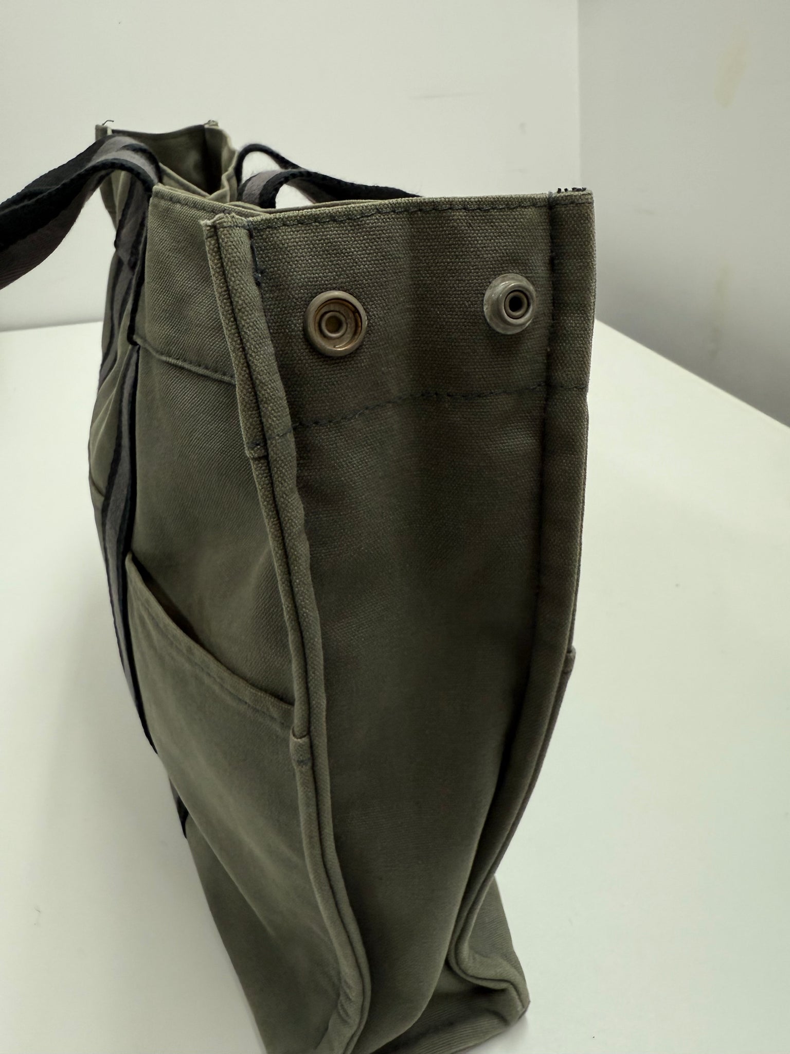 Gray bag with black straps on a white background Hermes Luxury Vintage Designer Hand bag Front Shot detail