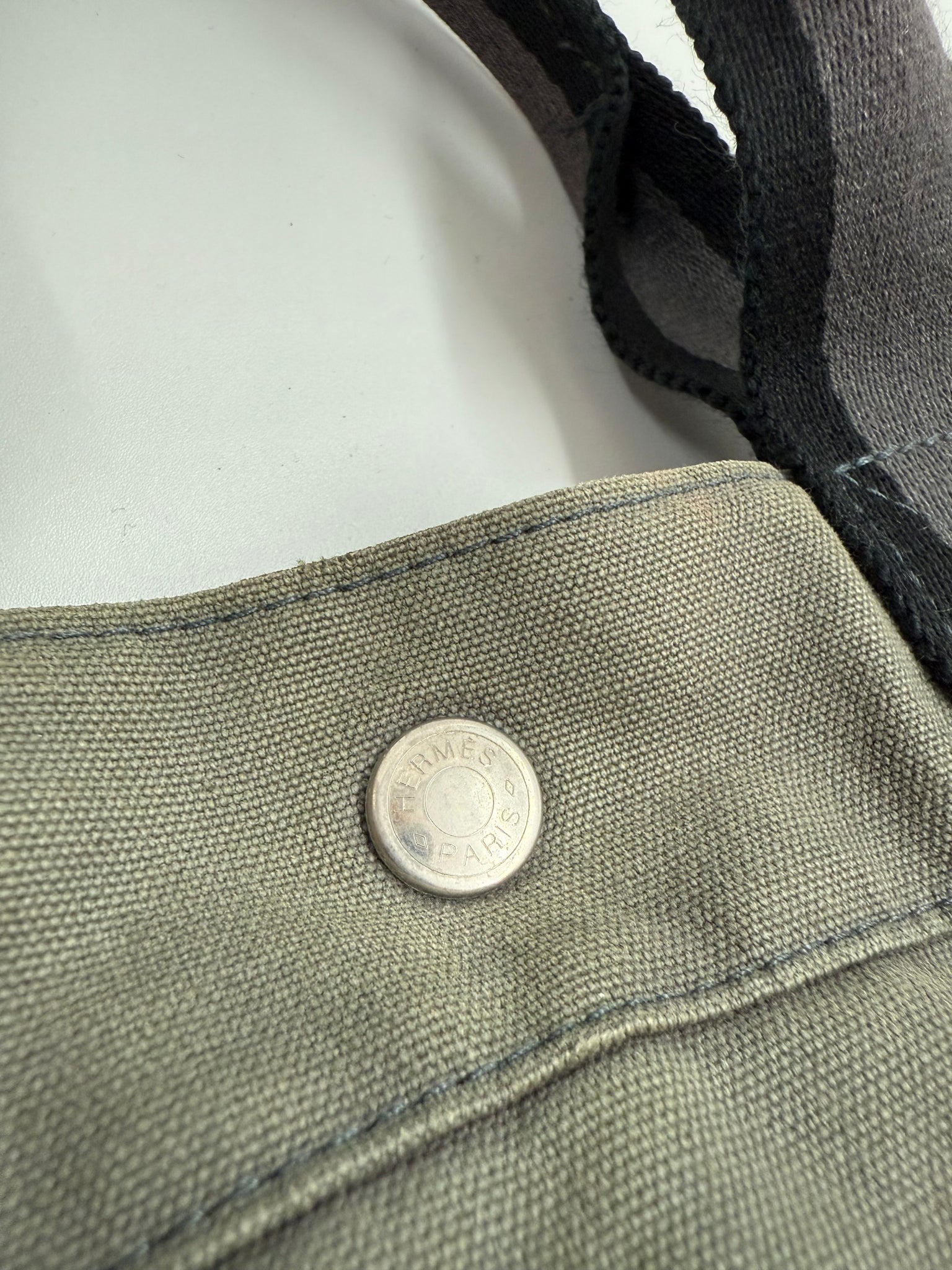 Gray bag with black straps on a white background Hermes Luxury Vintage Designer Hand bag Front Shot detail